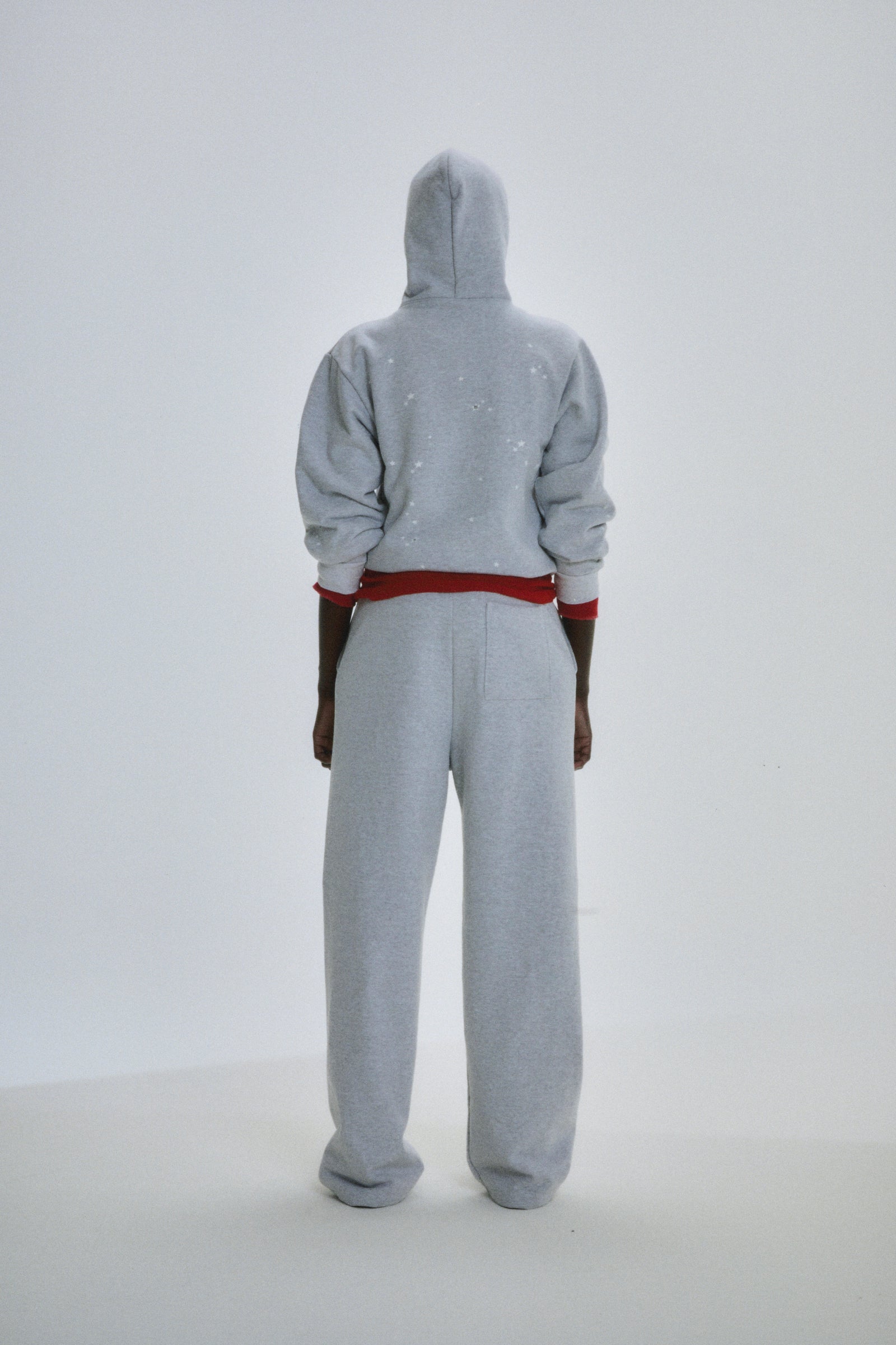 Gray 13oz cotton fleece Atlanta Full Zip Hoodie with scattered star print, red waistband, and matching sweatpants.