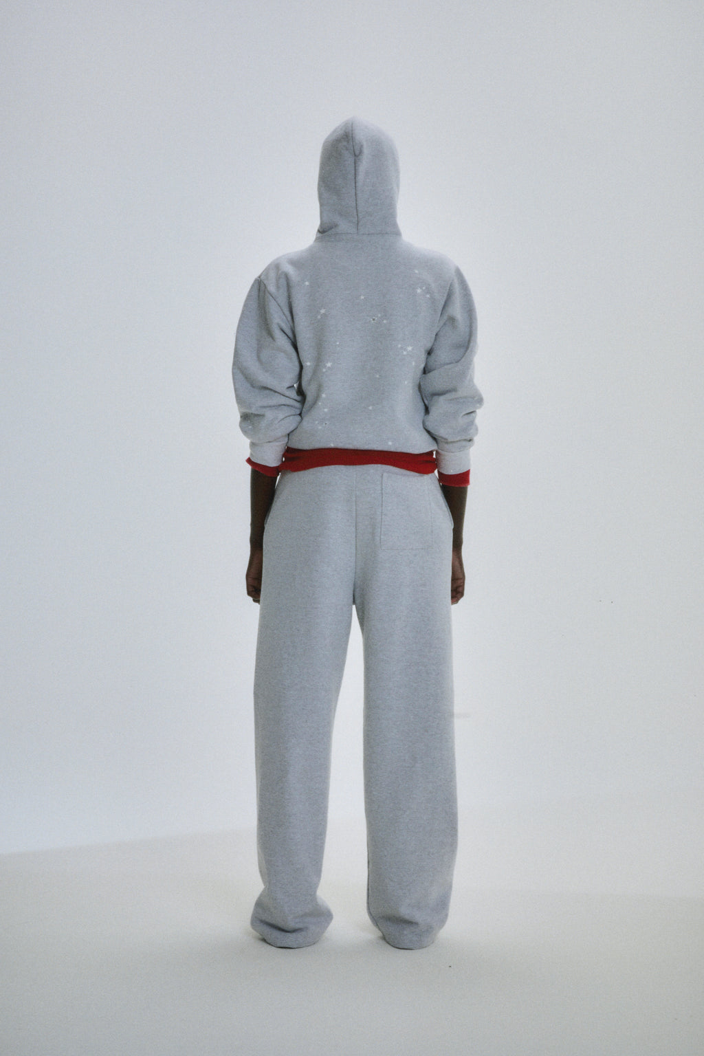 Gray 13oz cotton fleece Atlanta Full Zip Hoodie with scattered star print, red waistband, and matching sweatpants.