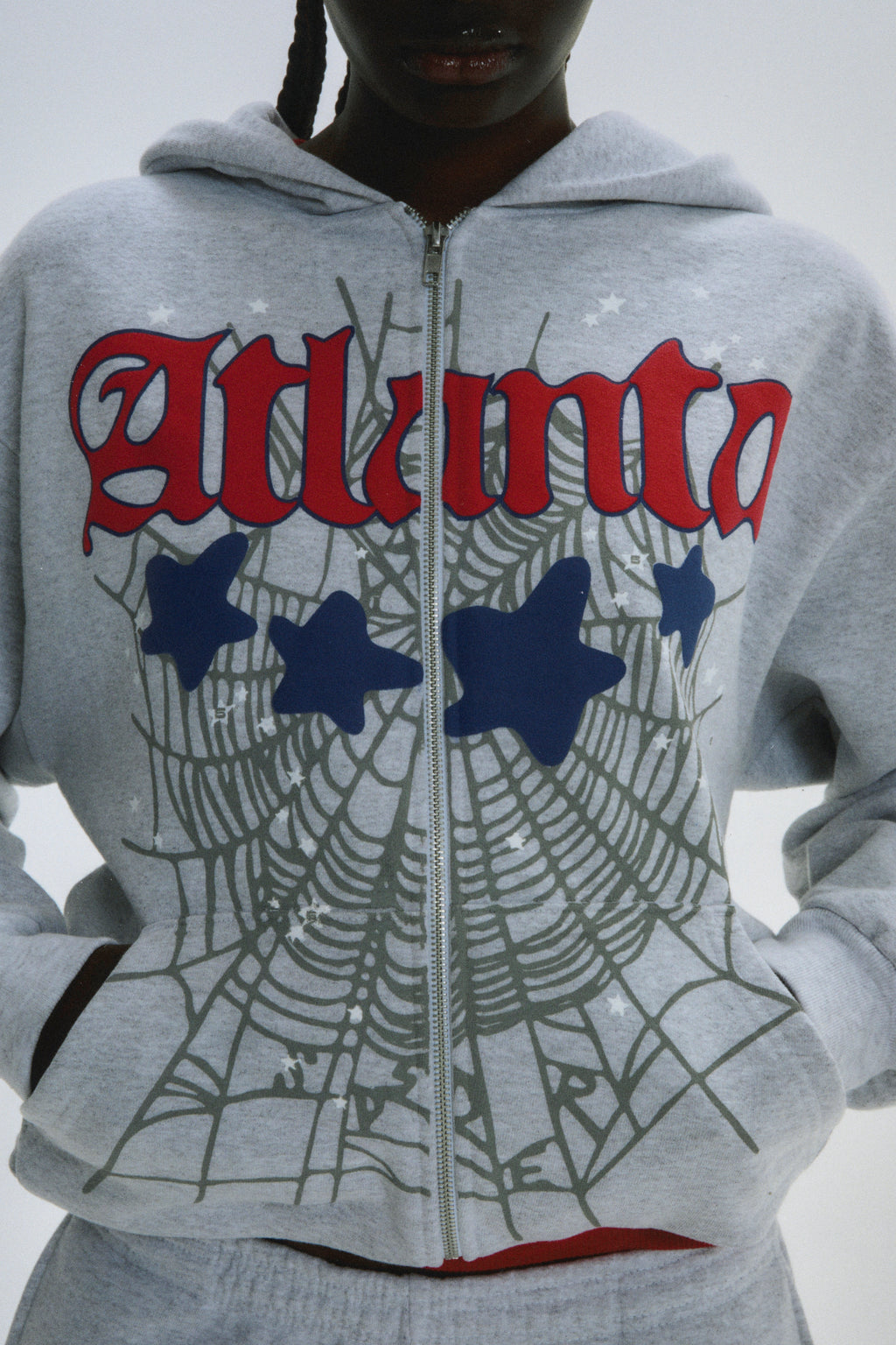 Grey 13oz cotton fleece Atlanta Full Zip Hoodie with red script, blue stars, and spiderweb print.