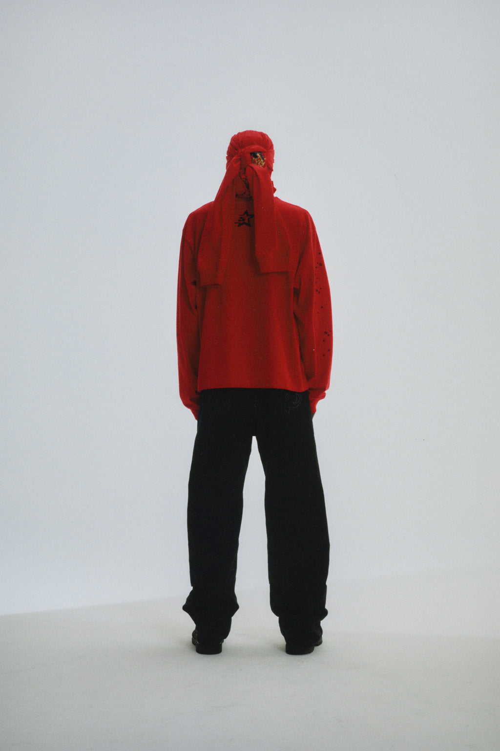 Red PUNK V2 LONGSLEEVE with 5star back motif and scattered tiny stars, worn with black pants.