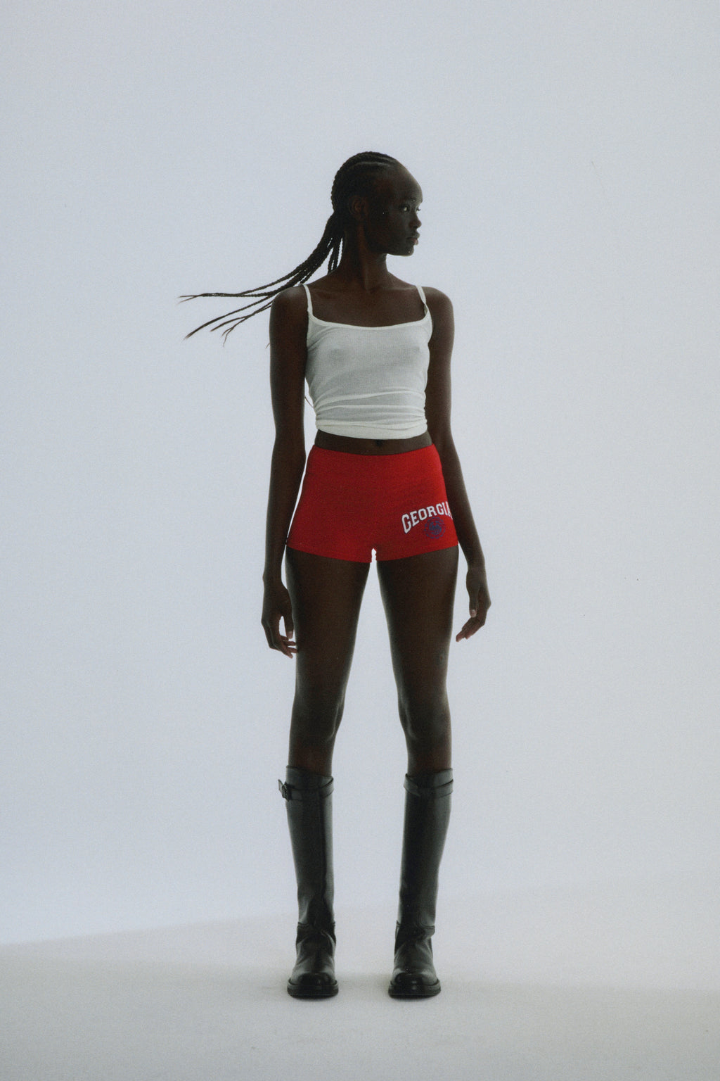 Red stretch cotton jersey short with "GEORGIA" collegiate graphic, worn by a model.