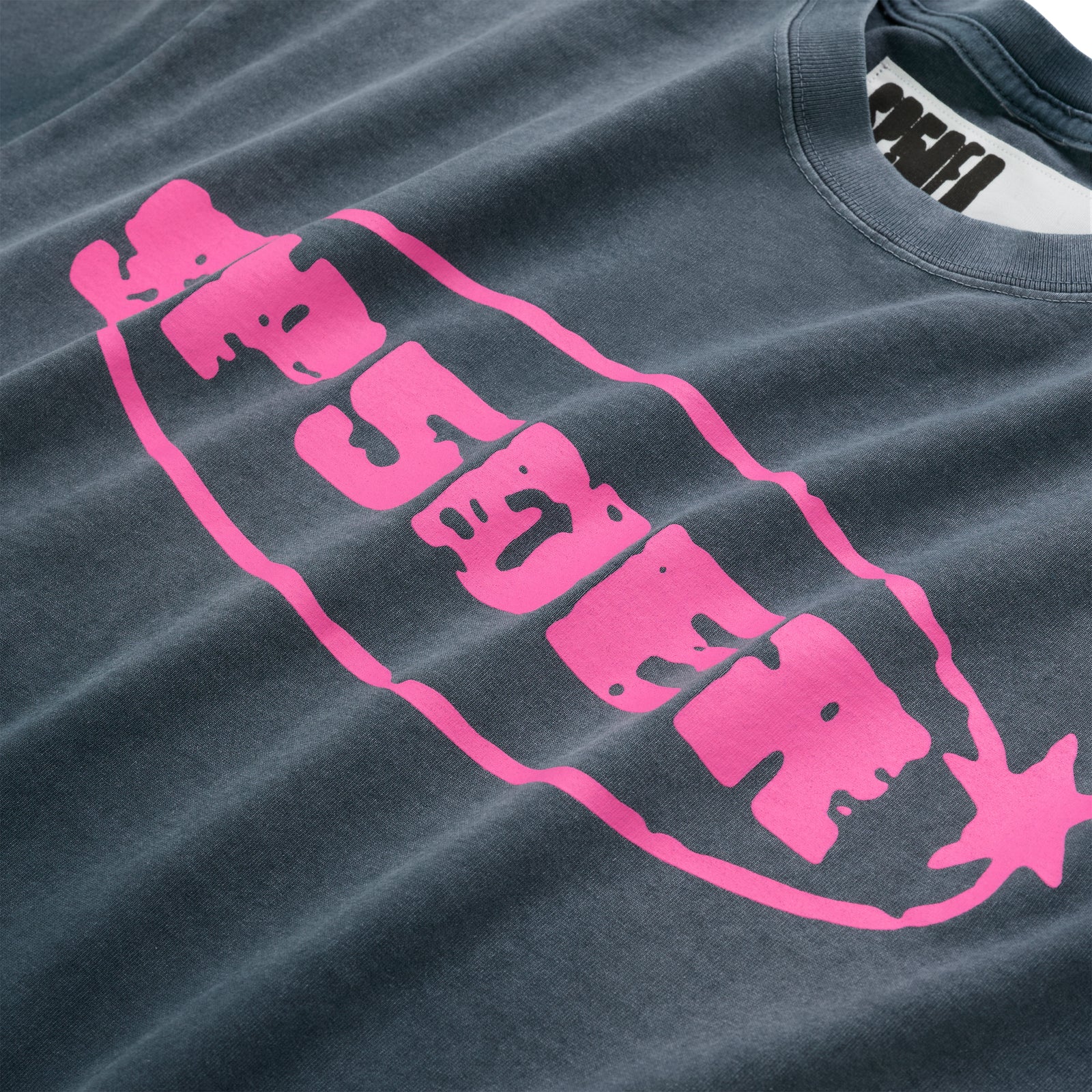 Faded black cotton tee with a large, vibrant pink graphic print on the front.