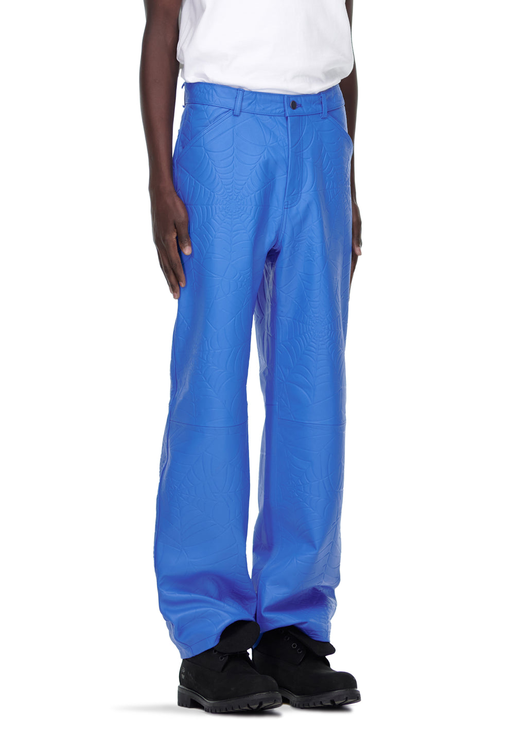 Male model in blue debossed web cowskin leather pants with four-pocket styling and belt loops.