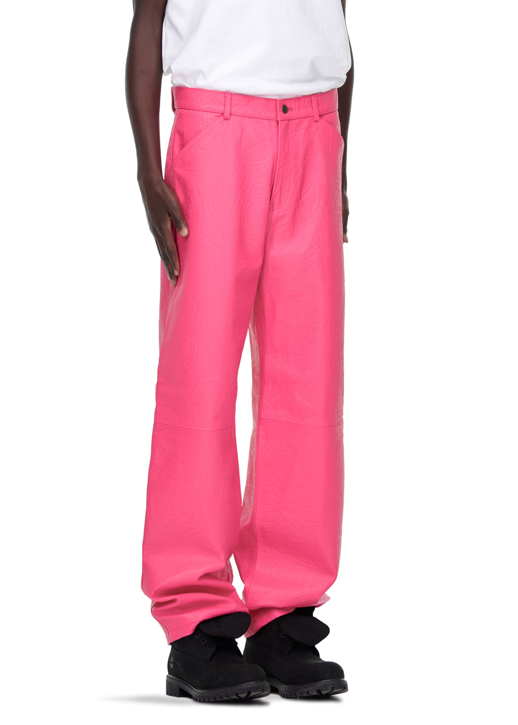 Male model in hot pink debossed web cowskin leather pants with button fly and belt loops.