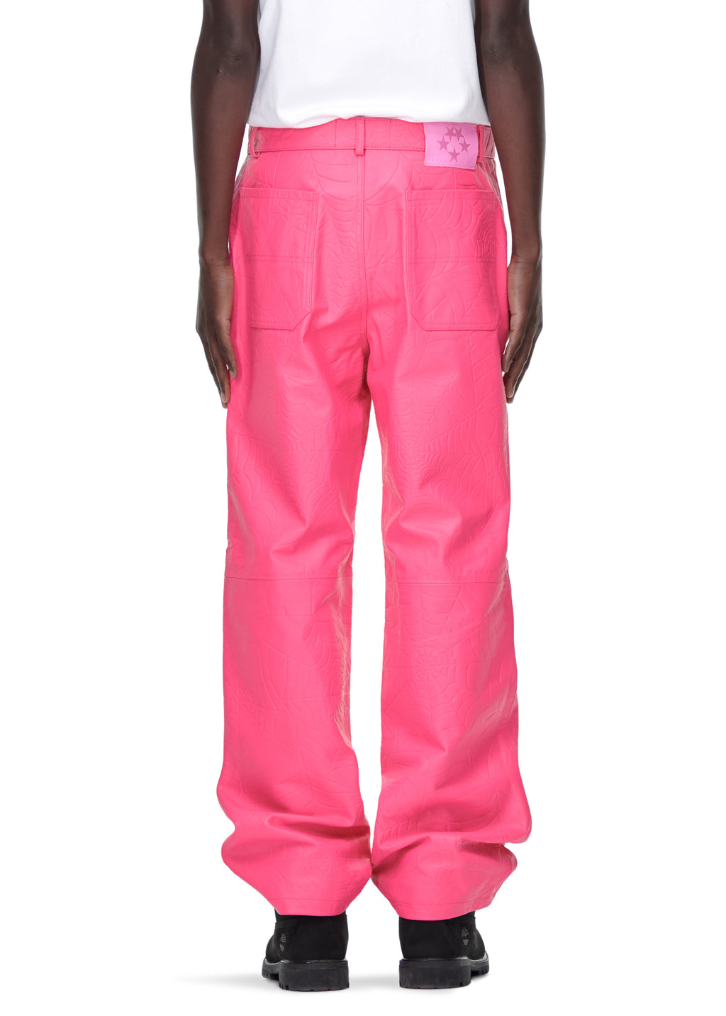 Men's pink cowskin leather pants with debossed web design and pink suede logo patch.