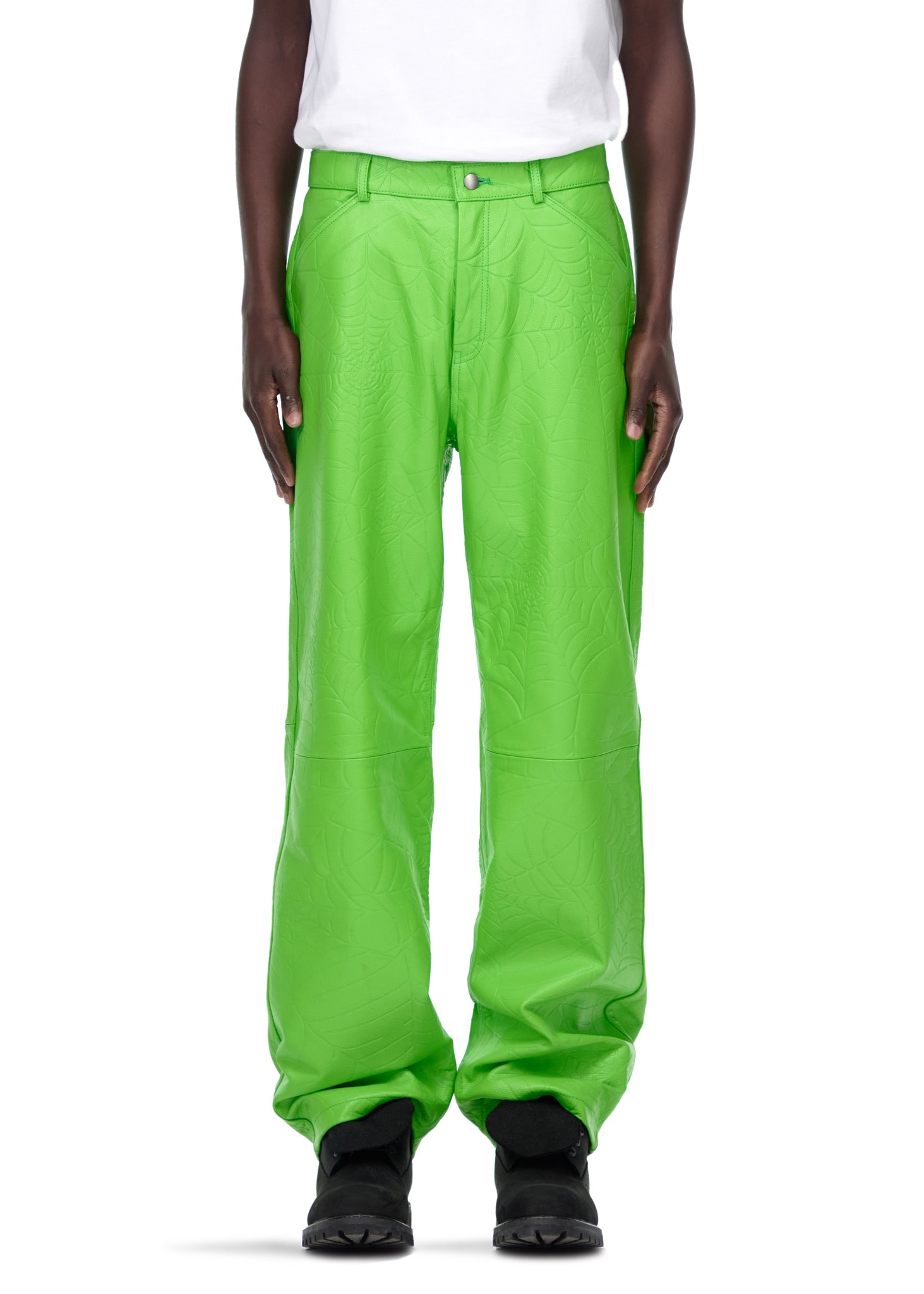 Male model in bright green debossed web cowskin leather pants with belt loops and button fly.