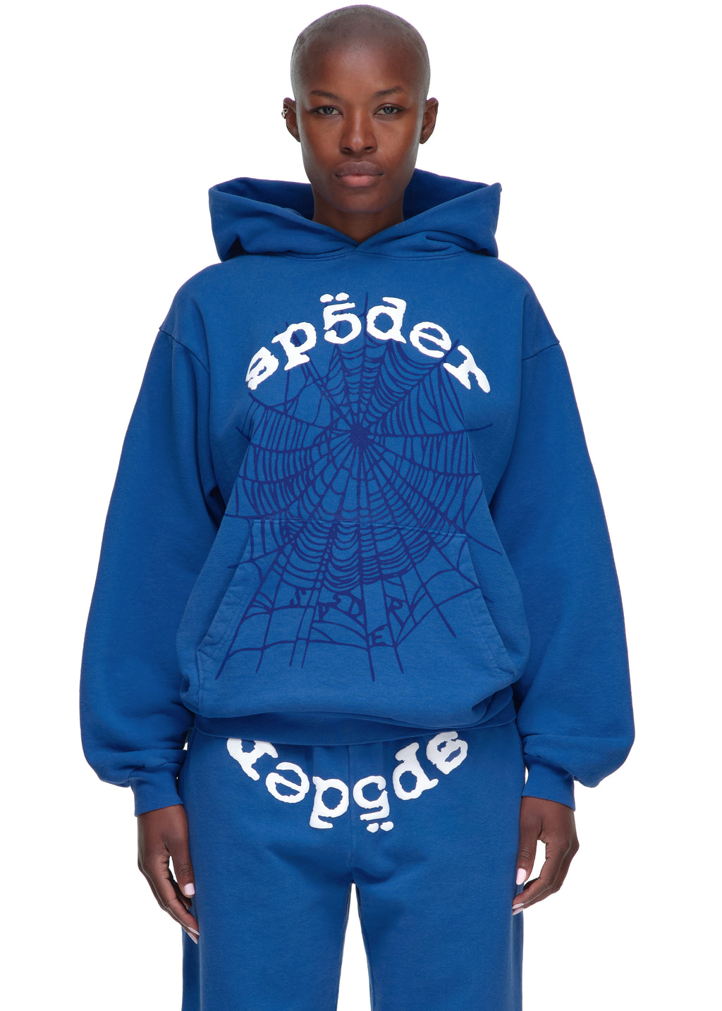Female model in a blue 23oz fleece Legacy Hoodie with white OG SP5DER V2 text and web puff print.
