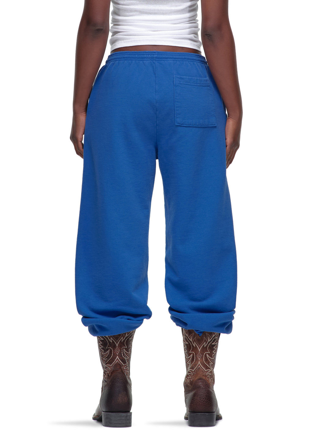 Blue 23oz fleece Legacy Sweatpants with puff/discharge print, worn by a model from behind.