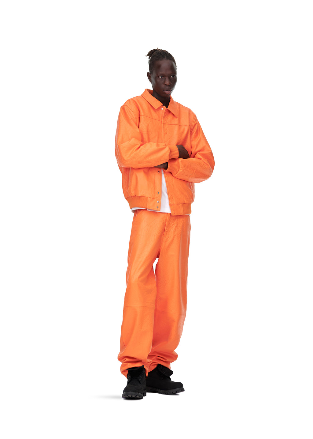 Male model in orange debossed web cowskin leather jacket and matching pants, size L.