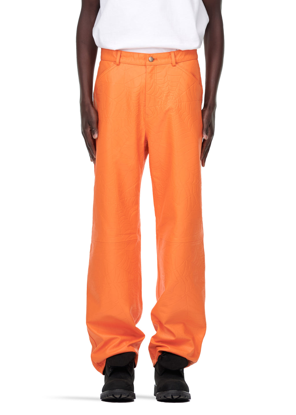 Orange DEBOSSED WEB LEATHER PANT, 100% cowskin with debossed web design, worn by a male model.