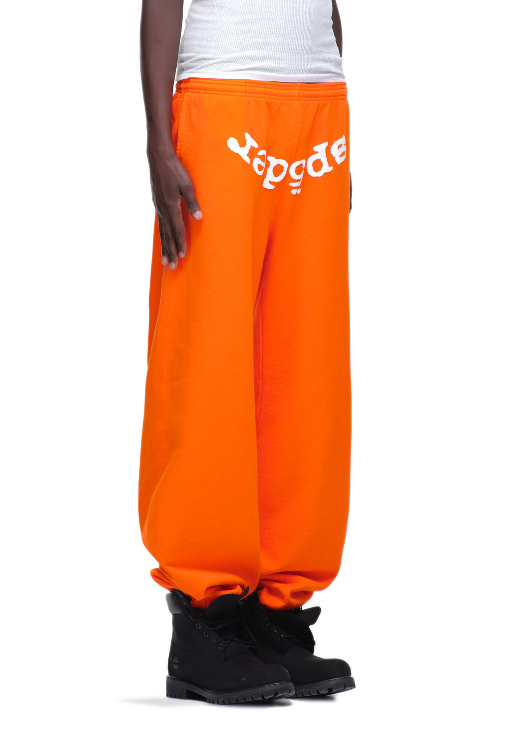 Orange LEGACY SWEATPANT with white "Sp5der" puff/discharge print, made from 23oz USA-milled fleece.