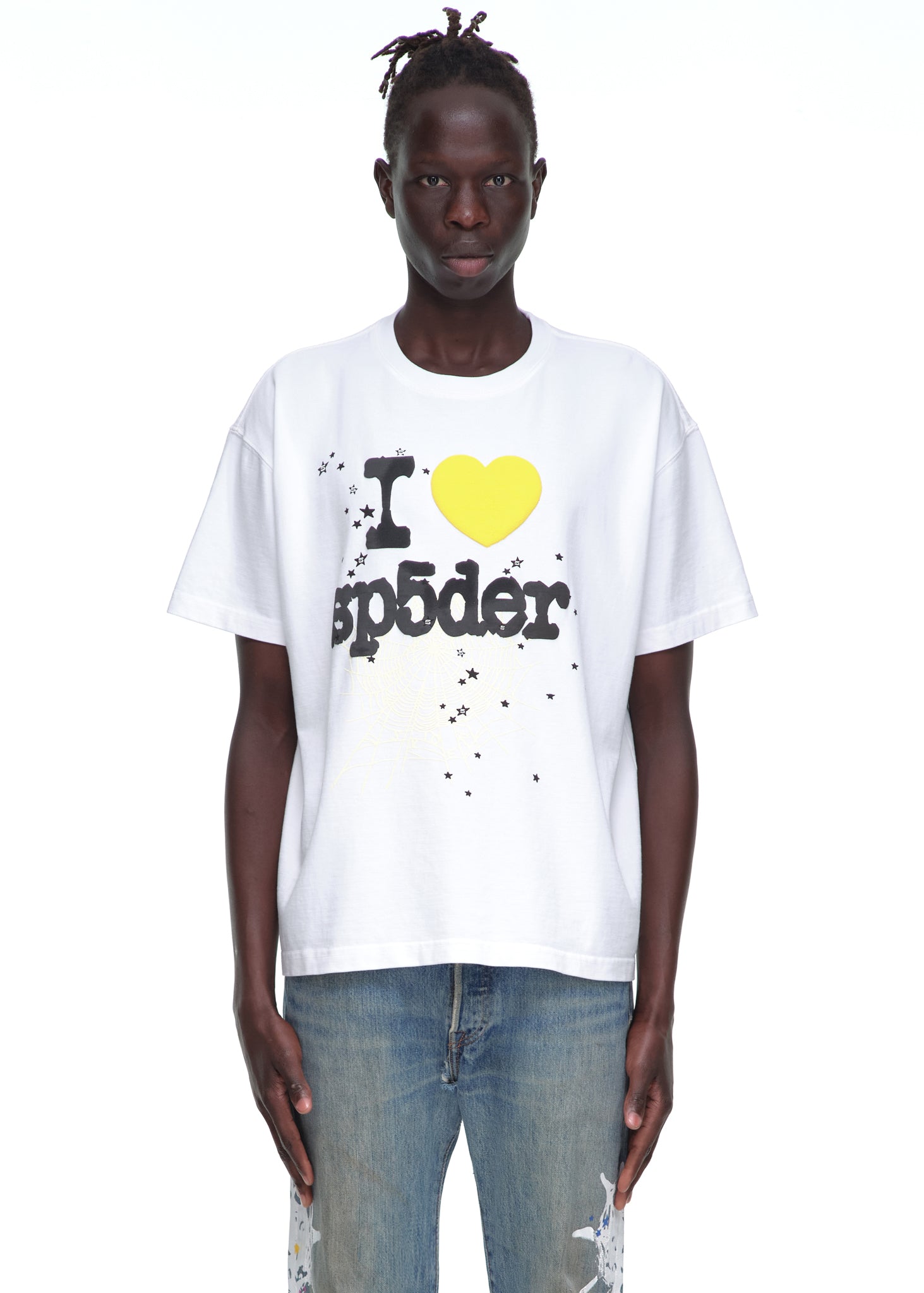 Male model in white 14oz cotton Souvenir Tee with "I <3 sp5der" graphic, black text, yellow heart.