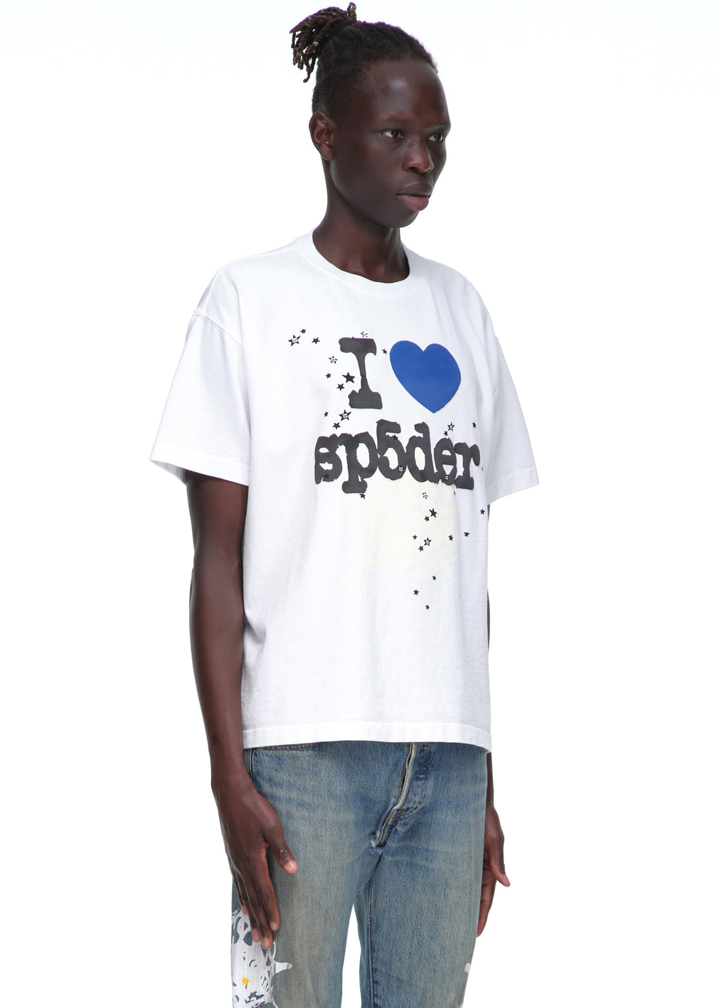 Male model in white 14oz cotton Souvenir Tee with "I ❤️ sp5der" graphic and star print.