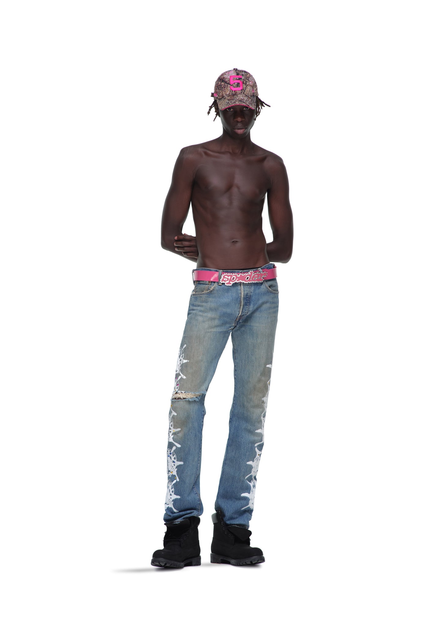 P*NK V2 BELT: Pink patent leather with rhinestones, stud fastening, and SP5DER text buckle.