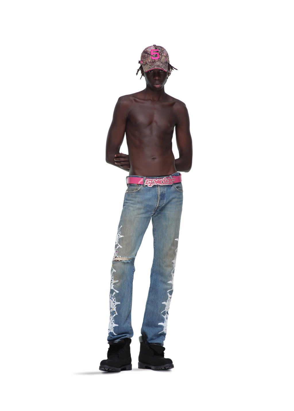 P*NK V2 BELT: Pink patent leather with rhinestones, stud fastening, and SP5DER text buckle.
