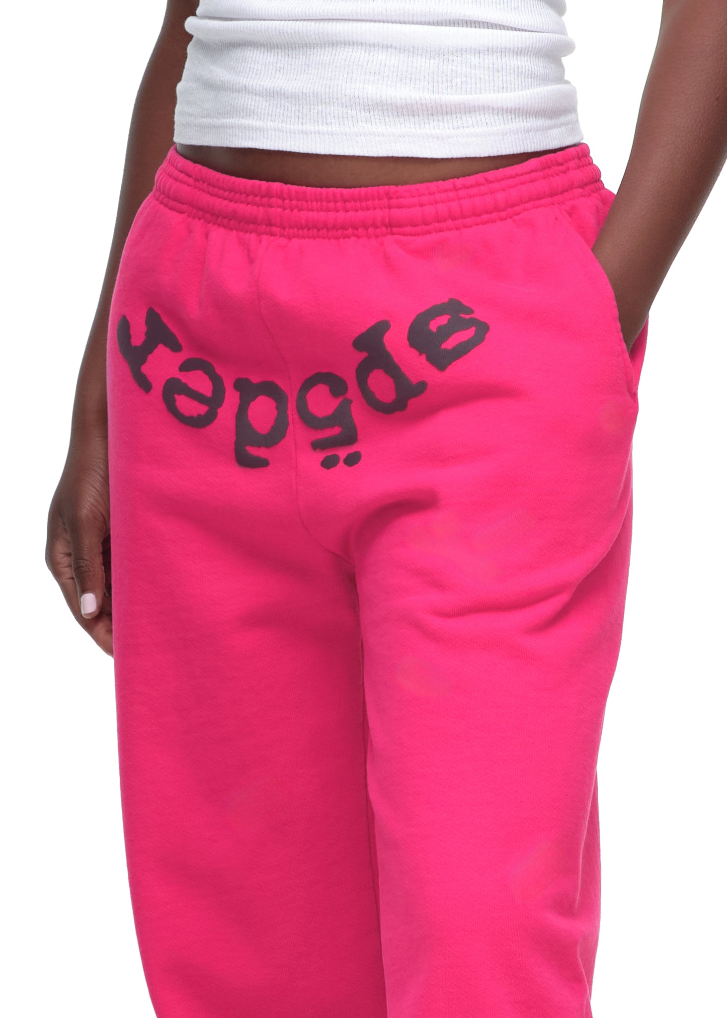 Bright pink LEGACY SWEATPANT with black "SP5DER" puff print, 23oz fleece.