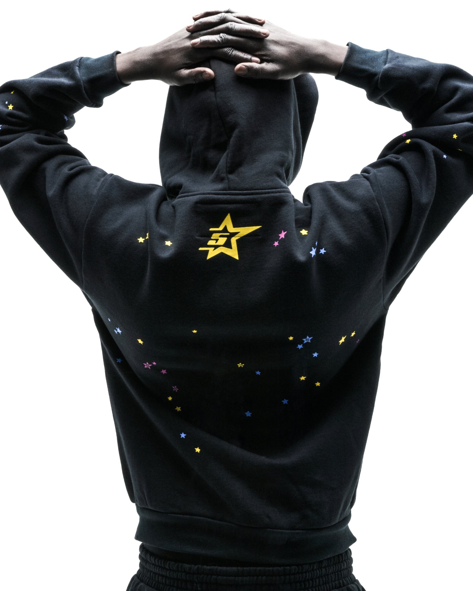Black PUNK V2 zip-up hoodie, 13oz cotton fleece, with yellow star logo and scattered colorful stars.