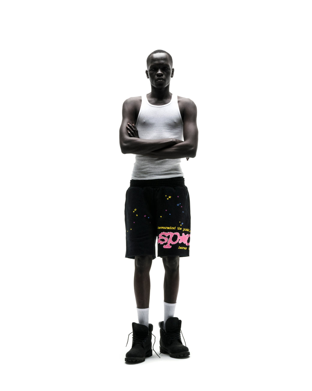 Black PUNK V2 SWEATSHORT with pink "SP5DER" text, scattered stars, drawcord, and raw hem.