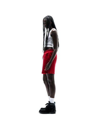 Model wearing red ANGEL NUMBER SHORT, 100% cotton brushed fleece with angel number print.