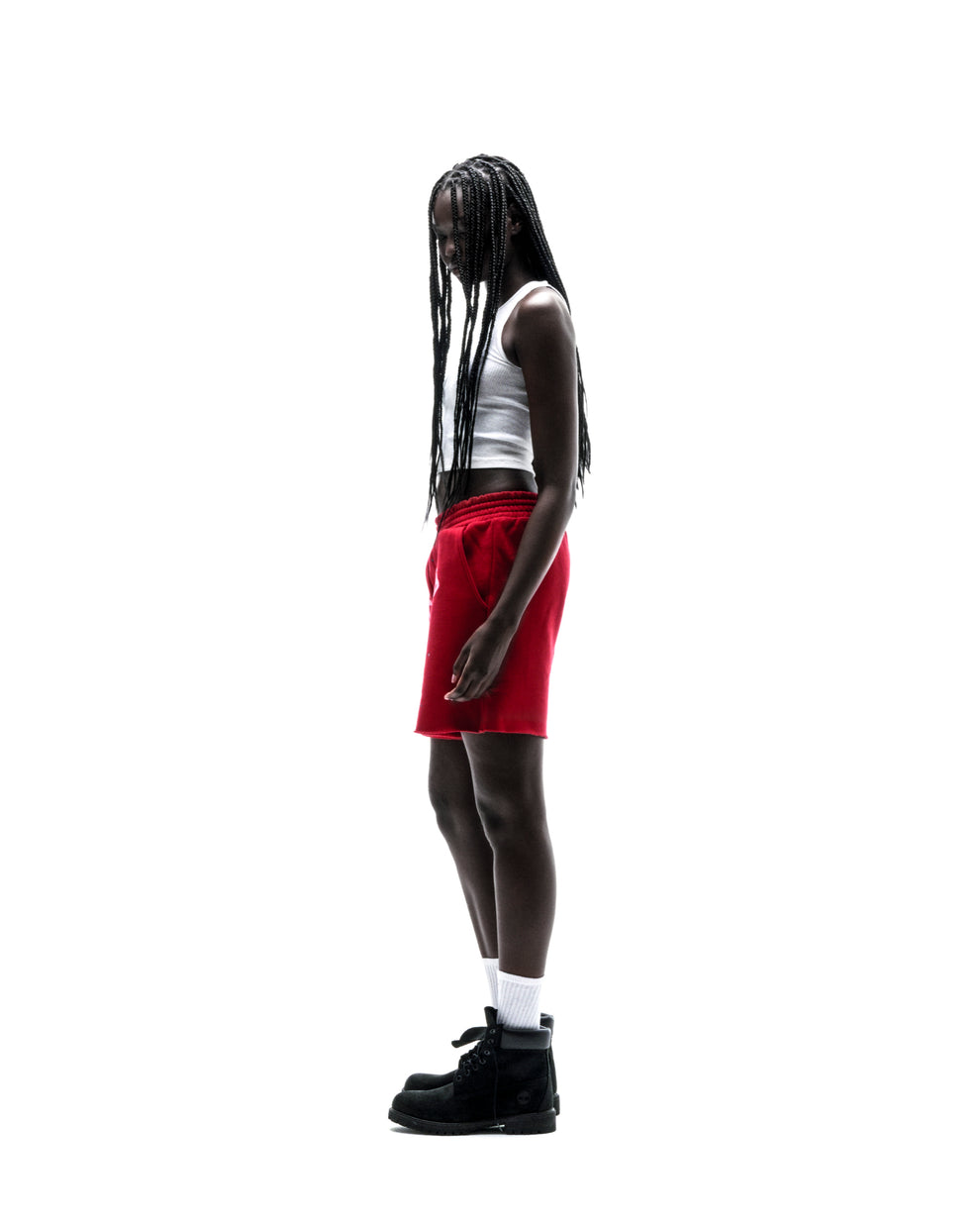 Model wearing red ANGEL NUMBER SHORT, 100% cotton brushed fleece with angel number print.