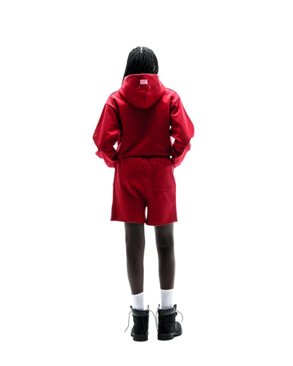 Red cotton fleece hoodie and shorts set with puff print details, worn by a person from behind.