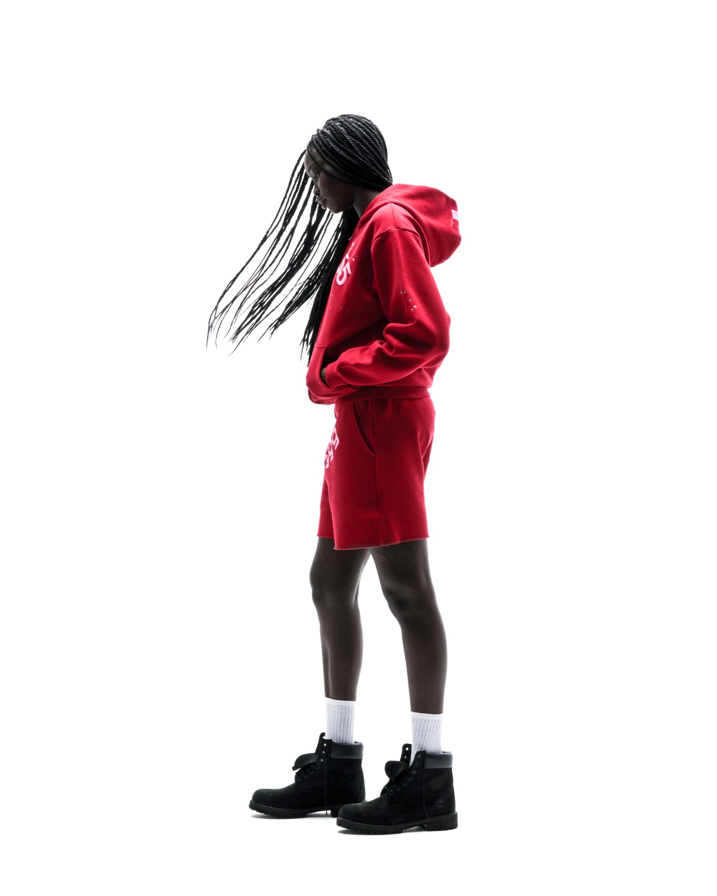 Red ANGEL NUMBER ZIP HOODIE and matching shorts on a person, featuring puff print and scattered stars.
