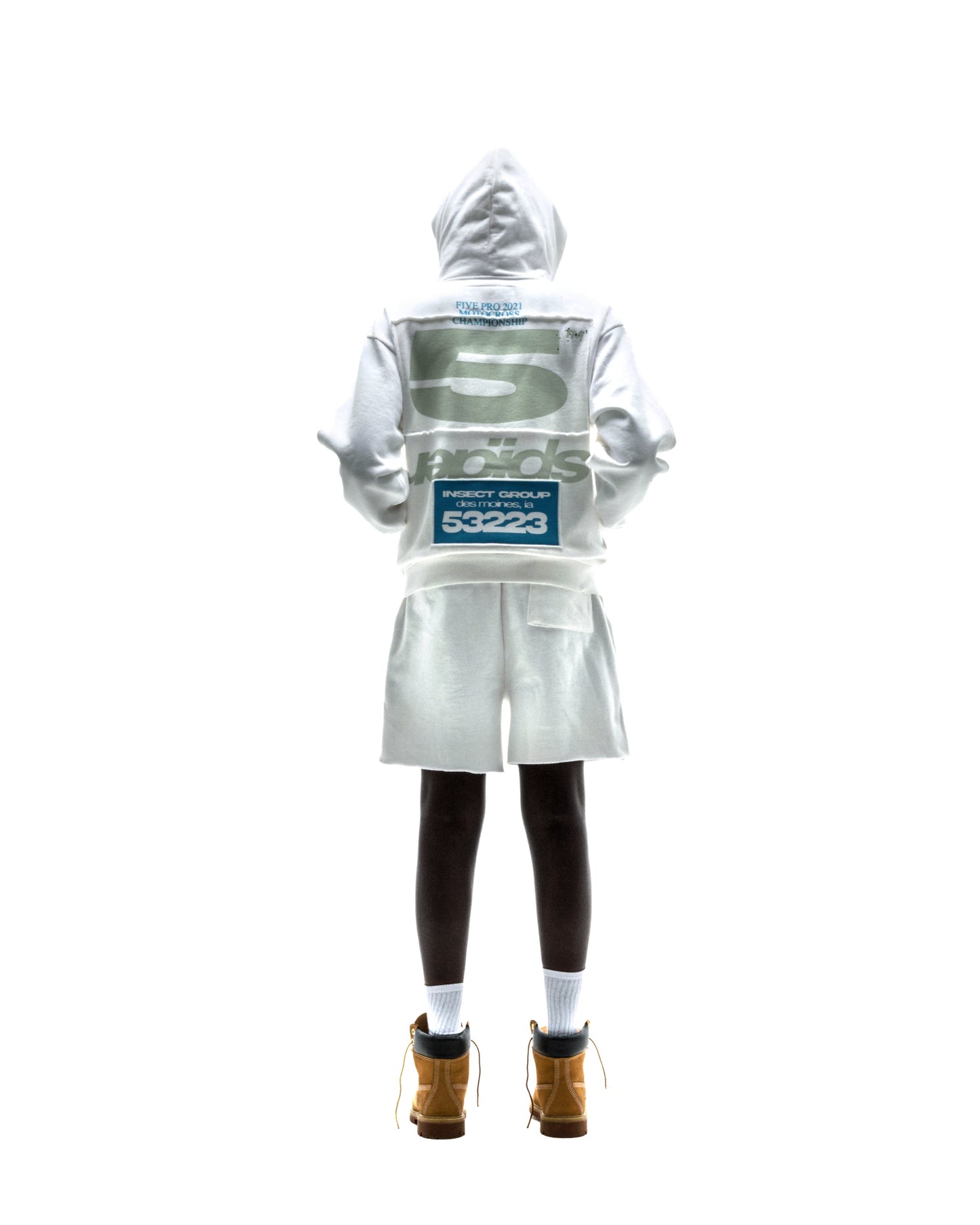 Model in white T&F ZIP UP hoodie and shorts, featuring puff/discharge print and scattered stars.