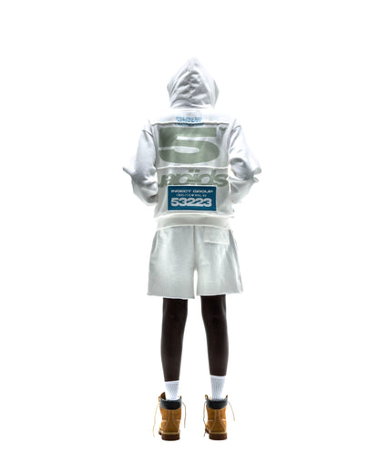 Model in white T&F ZIP UP hoodie and shorts, featuring puff/discharge print and scattered stars.
