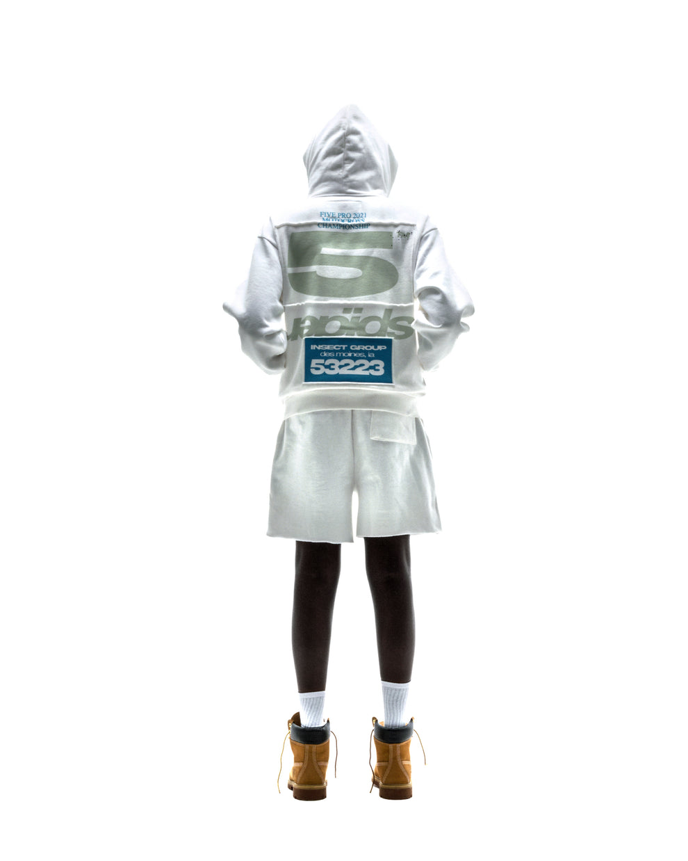 Model in white T&F ZIP UP hoodie and shorts, featuring puff/discharge print and scattered stars.