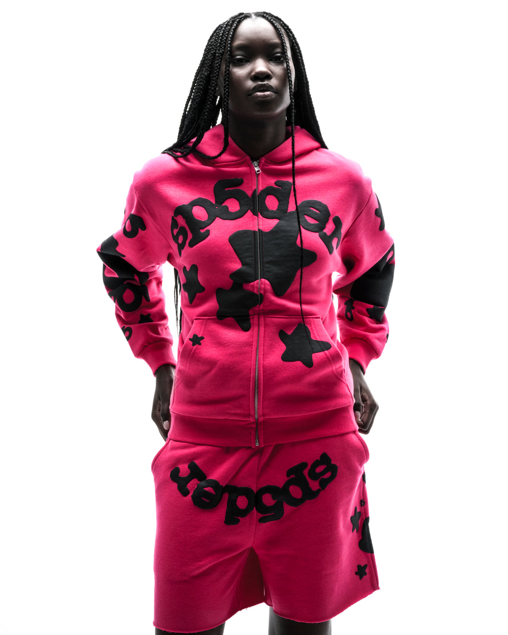 Model in a hot pink 13oz cotton fleece Beluga Zip Up hoodie and matching shorts with black puff print.