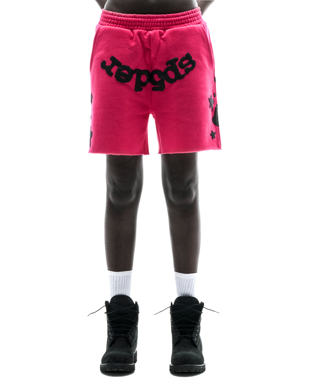 Model wears pink Beluga print cotton fleece sweatshorts with raw hem and black boots.