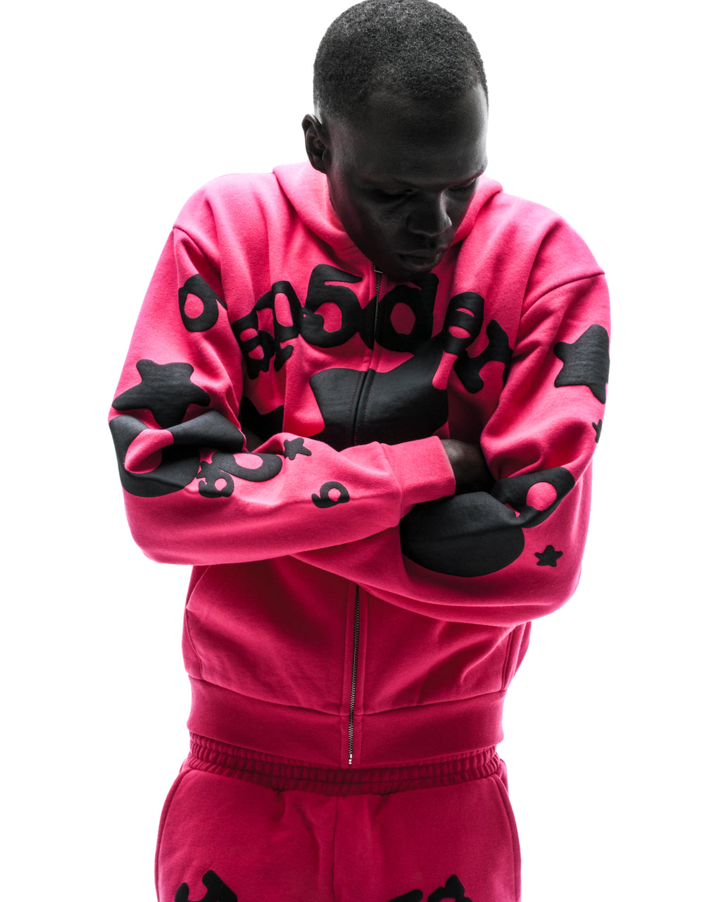 Model in a pink 13oz cotton fleece Beluga zip-up hoodie with black puff/discharge print, welt pockets.