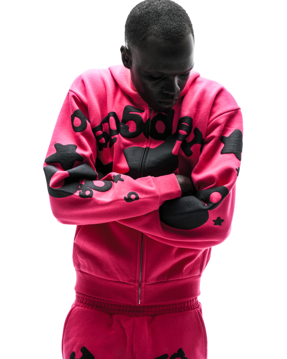 Model in a pink 13oz cotton fleece Beluga zip-up hoodie with black puff/discharge print, welt pockets.