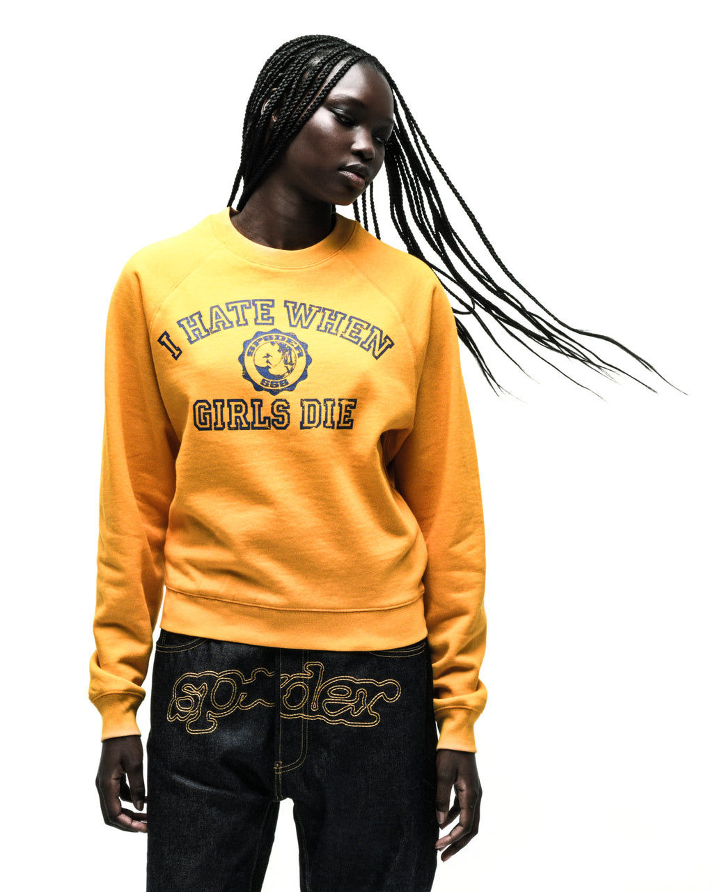 Yellow 100% cotton raglan crewneck featuring a blue graphic print on the front with ribbed collar, hem, and cuffs.
