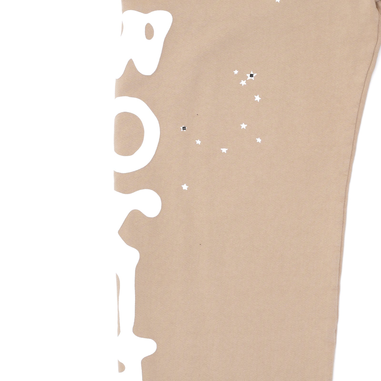 Sand Beluga sweatpant with white puff print text and small star graphics on the leg.