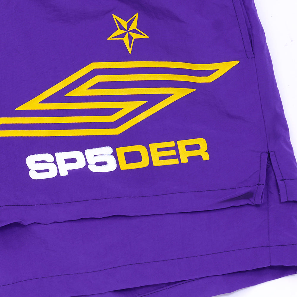 GRAPE SP5 PRO SHORT: Purple water-repellent nylon shorts with yellow star and logo, white "SP5DER" text.