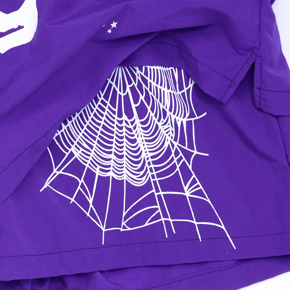 Purple nylon shorts with a white spider web graphic and small stars.
