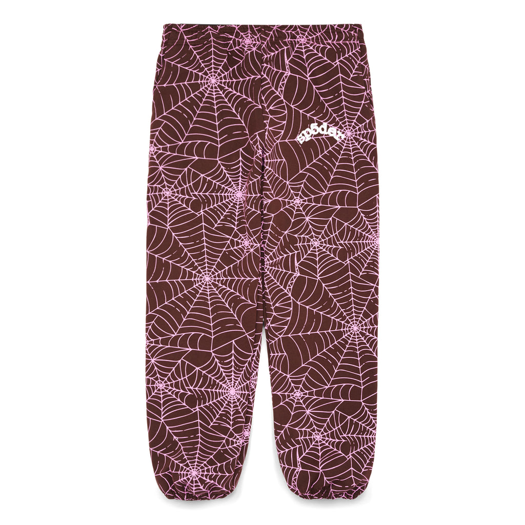 Brown fleece sweatpants with all-over pink cracked web print and "SP5DER" text.
