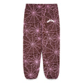 Brown fleece sweatpants with all-over pink cracked web print and "SP5DER" text.