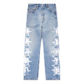 Vintage Levi's 501 light wash denim jeans with white contrast web design and colorful paint splatters down the legs.