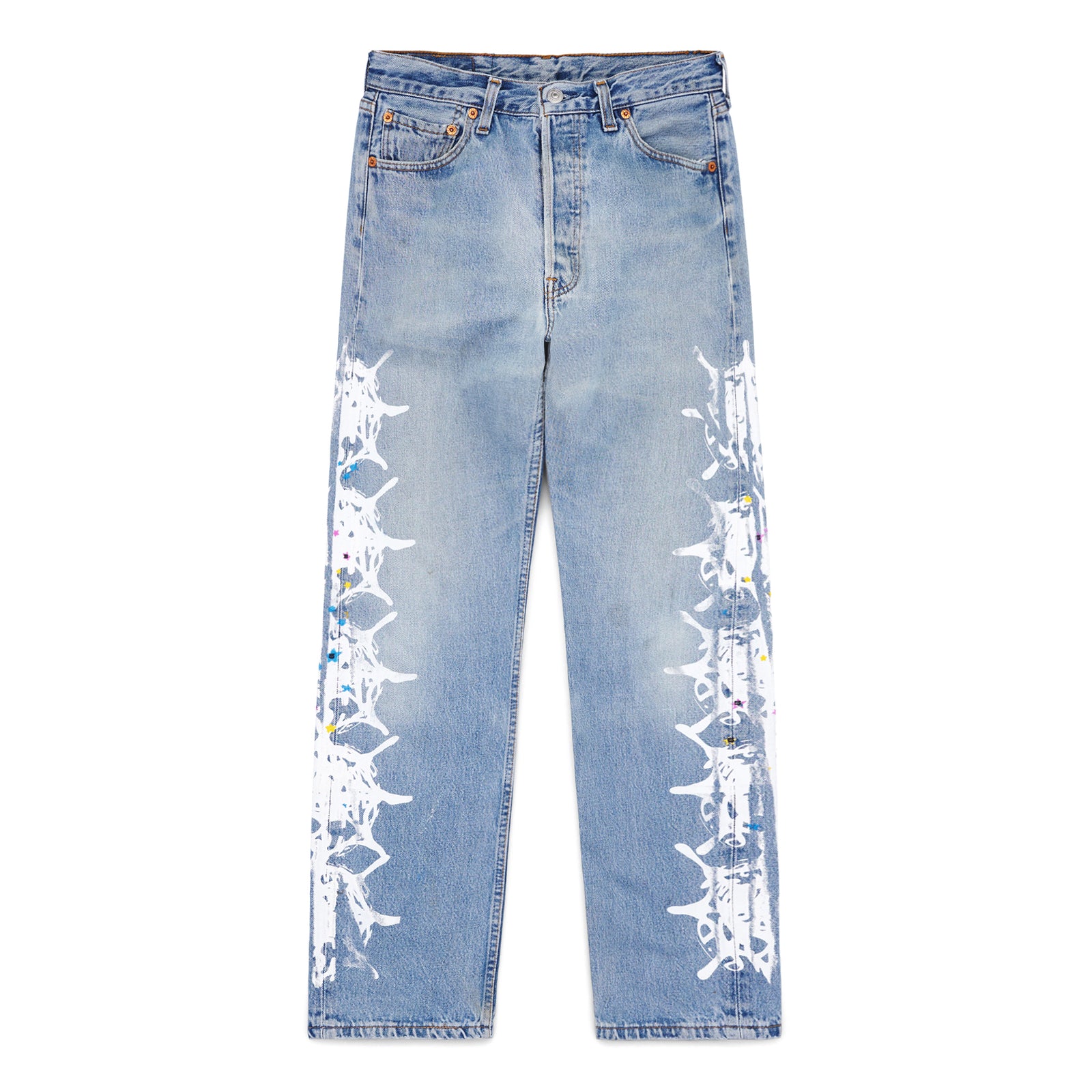 Vintage Levi's 501 denim jeans with white contrast web design down each leg, featuring colorful paint splatters.
