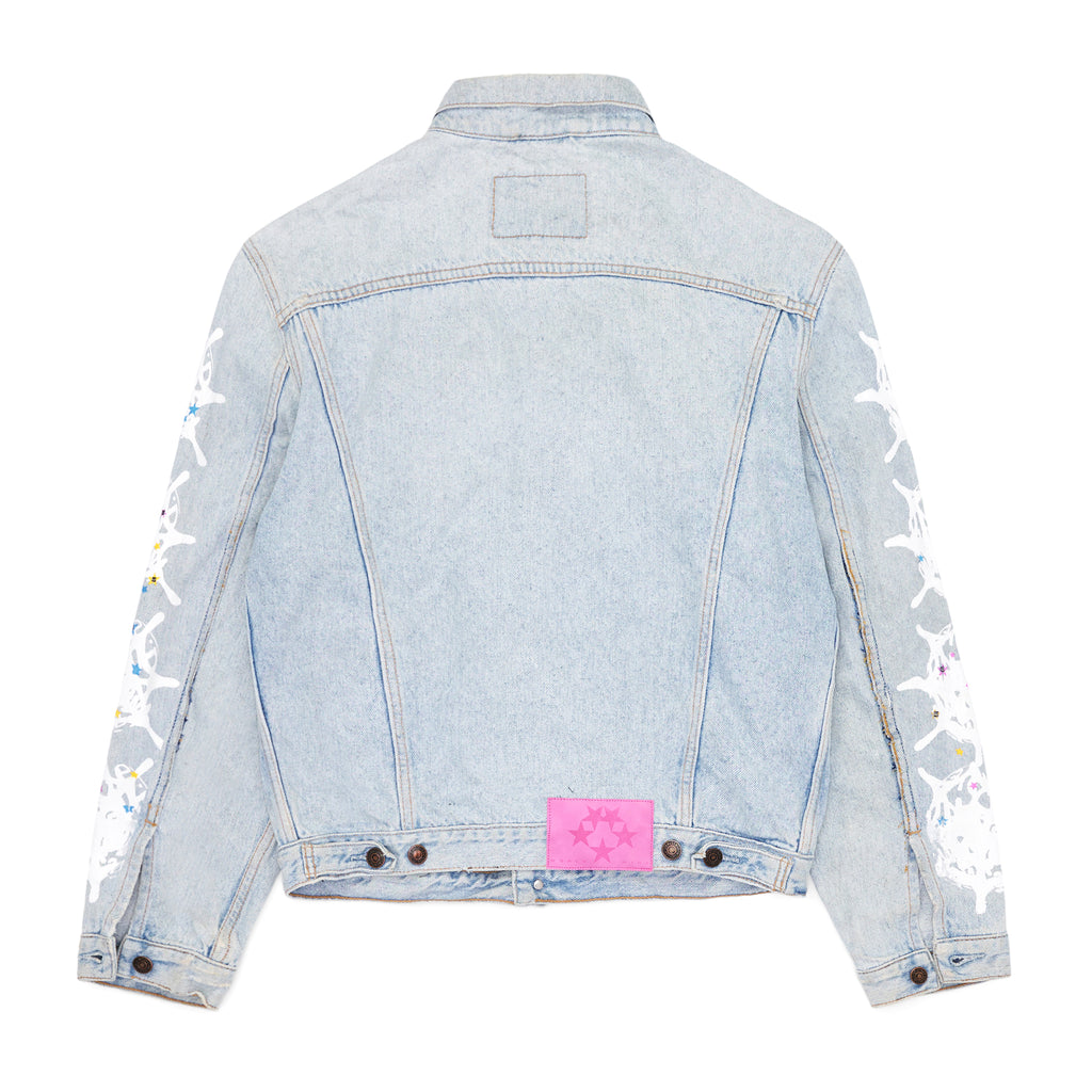 Vintage Levi's light wash denim trucker jacket with white contrast web on arms and a pink SP5DER leather back tab.