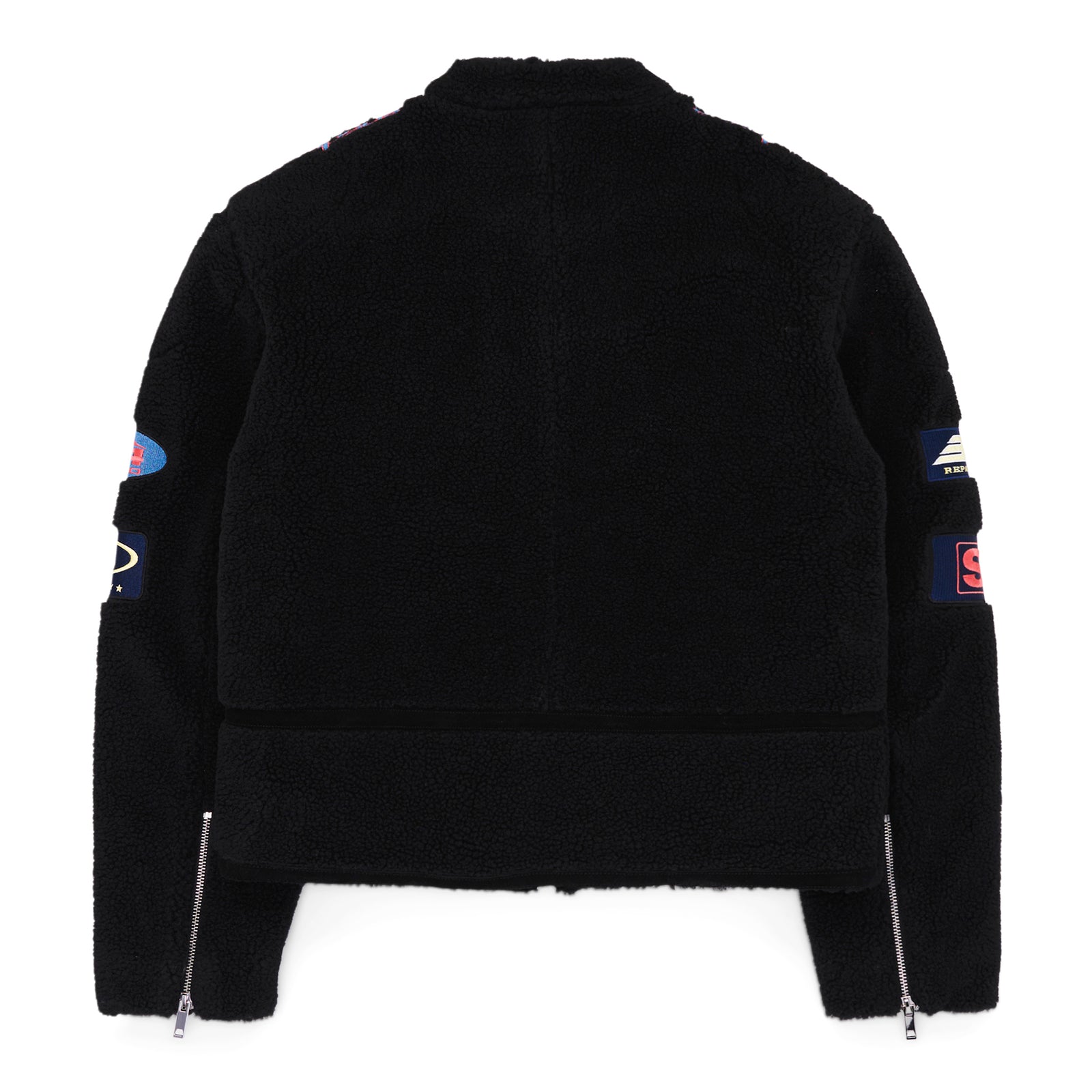 Black sherpa moto jacket with custom SP5DER patches, leather trim, zip closure, and sleeve zippers.