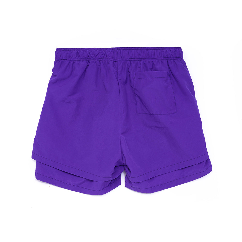 Back view of GRAPE SP5 PRO SHORT, purple 4oz water repellent nylon with high-low double layer and patch back pocket.