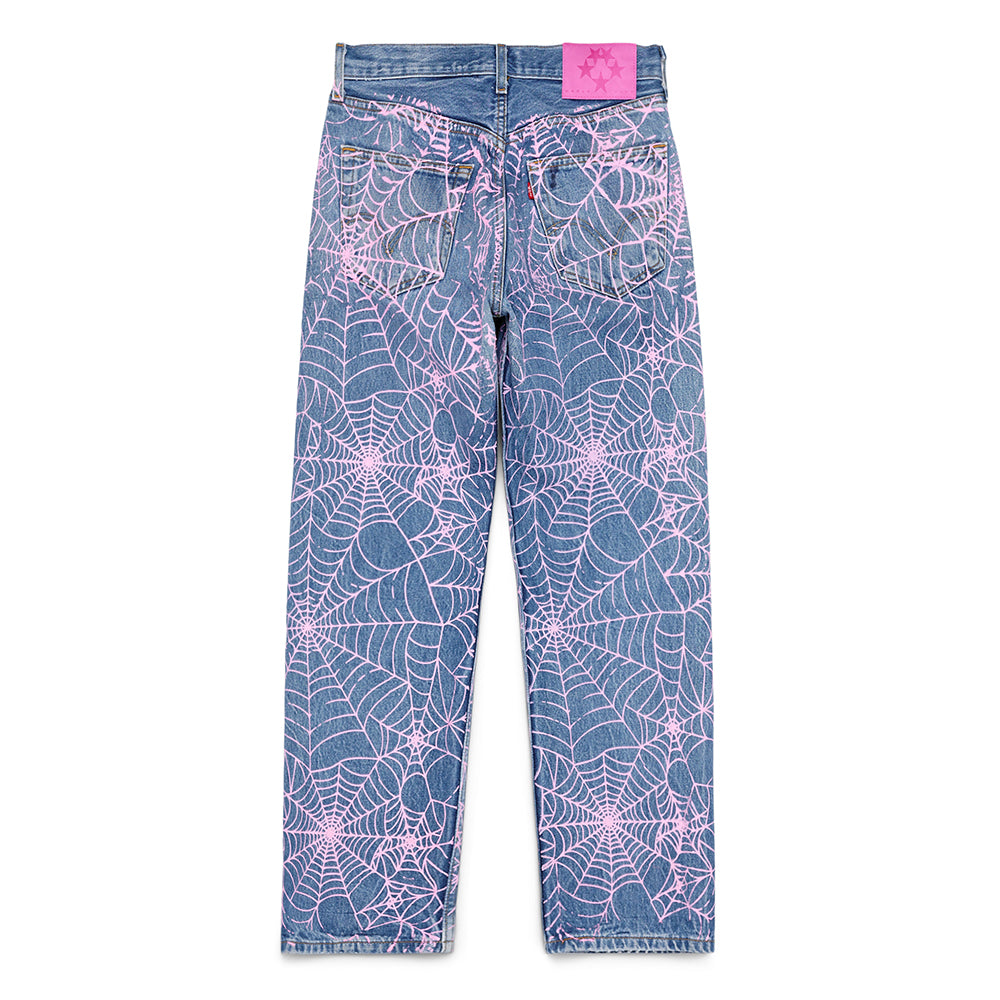 Vintage Levi's 501 denim jeans with all-over pink spider web print and a pink leather SP5DER back tab.