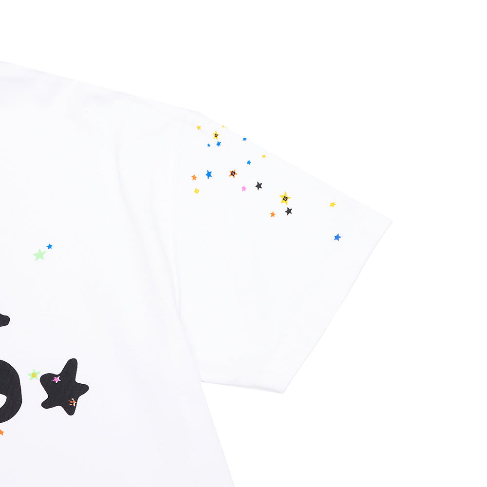 White 14oz cotton tee with colorful star confetti design on the sleeve and chest.