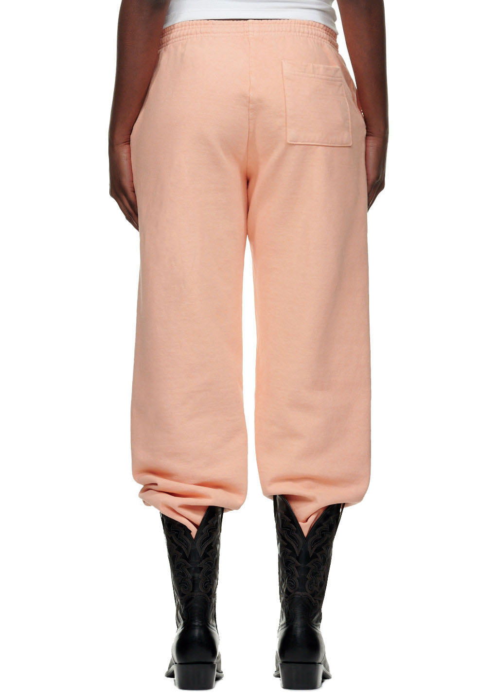 SP5 Bellini Sweatpant, light peach 23oz fleece, with back pocket, worn with black cowboy boots.