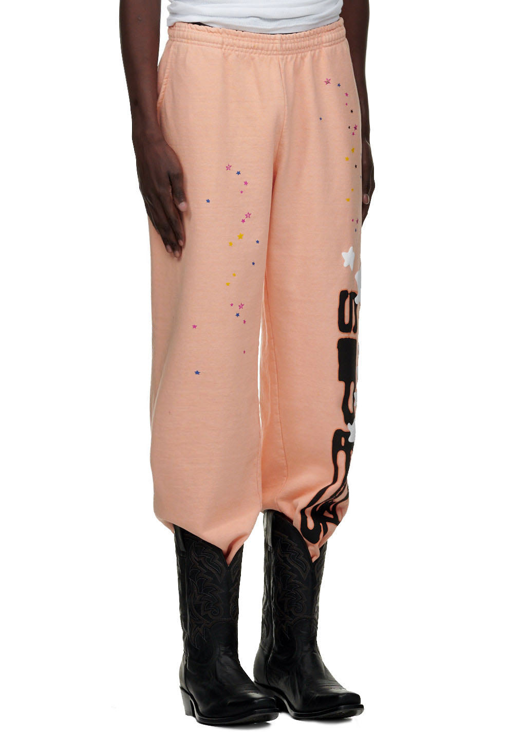 Bellini SP5 sweatpants, peach 23oz fleece, with black SP5 text, stars, and cowboy boots.