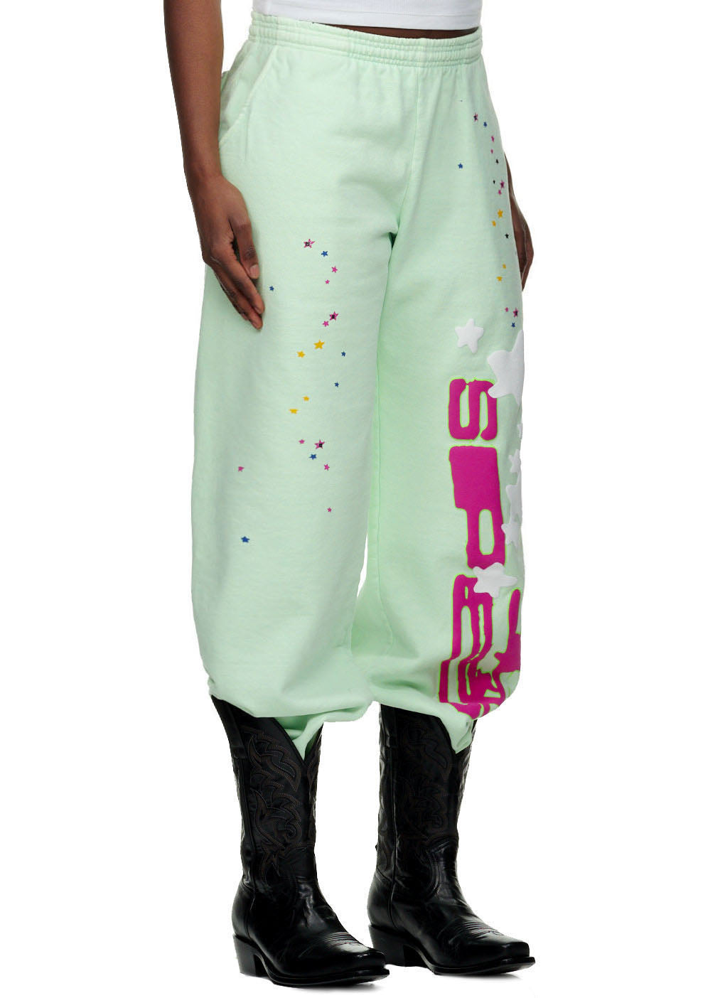 Mint green SP5 sweatpants with puff print "SP5" and star design down the leg.