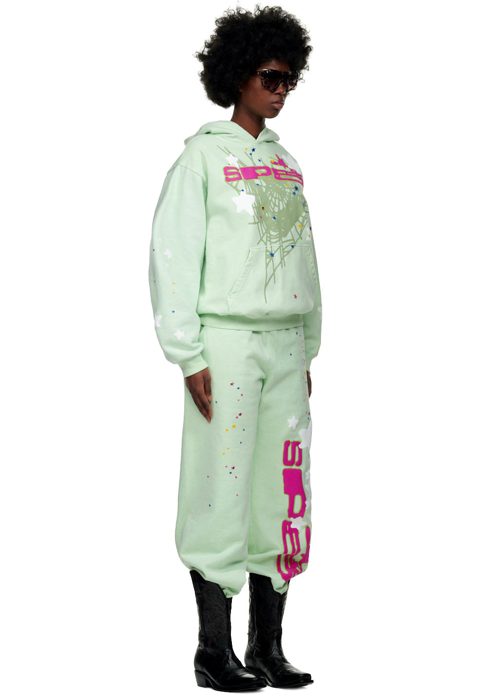 Mint green fleece hoodie and sweatpants set with "SP5" puff print, web/star design, and colorful splatters.